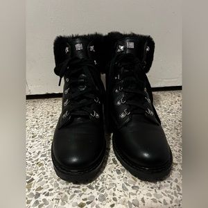 Black leather boots with fur on the ankles.